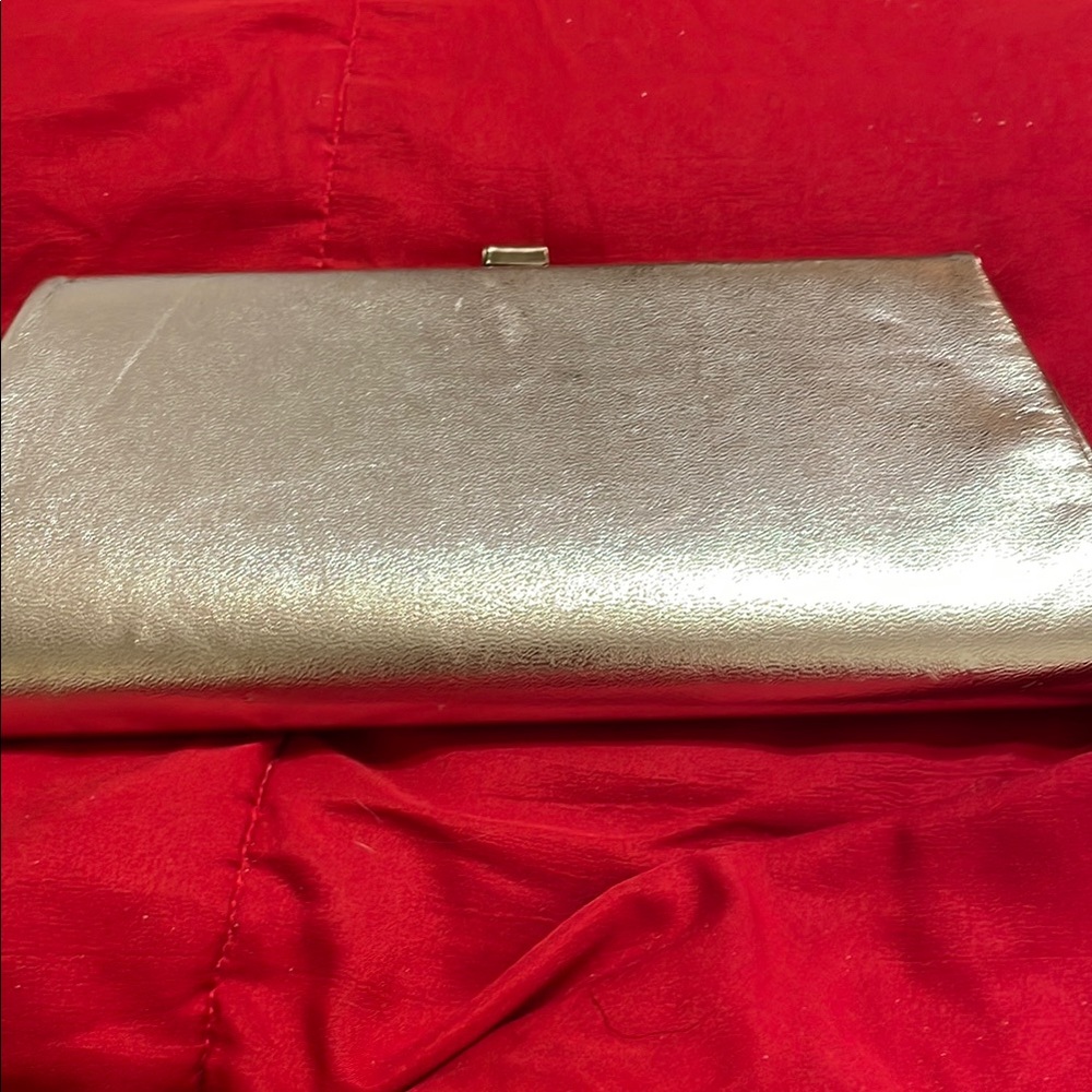 Sleek Silver Clutch with Shimmery Finish and Snap Closure